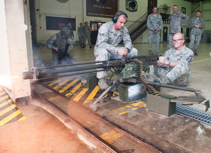 KUNSAN AIR BASE, Republic of Korea – Chief Master Sgt. of the Air Force James A. Cody fires an M2 Browning Machine Gun during a demonstration Aug. 24, 2013. As part of their visit to Kunsan, Cody and Air Force Chief of Staff Gen. Mark A. Welsh III were shown how Airmen defend the base. Their visit to the Wolf Pack was part of a two-week tour to thank Pacific Air Forces Airmen and families for their support and to discuss challenges and opportunities in the region. (U.S. Air Force photo by Senior Airman Armando A. Schwier-Morales/ Released)