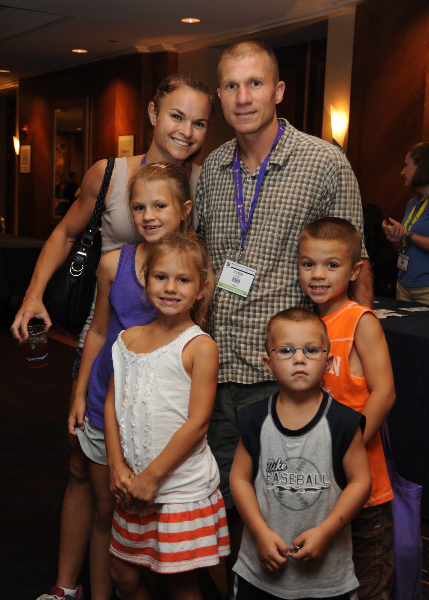 The Keeney family attends a Yellow Ribbon Program event in Arlington, Va., on Aug. 23, 2013.  The Air Force Yellow Ribbon Program provides Reserve members and their families with information, services, referrals, and proactive outreach opportunities throughout the deployment cycle.  (U.S. Air Force photo by Tech. Sgt. Peter R. Miller).
