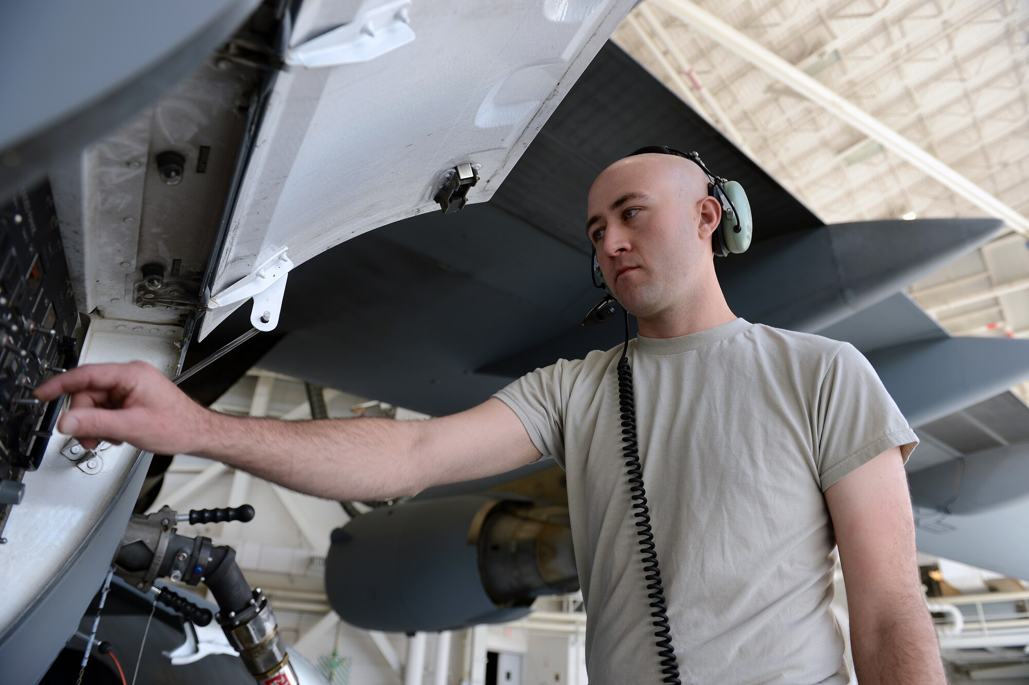Airman 1st Class Benjamin Walker, 62nd Maintenance Squadron aircraft fuels systems technician, monitors gages on a C-17 Globemaster III aircraft during a refueling operation, Aug. 16, 2013, at Joint Base Lewis-McChord, Wash. Capable of carrying more than 249,000 pounds of fuel, each of McChord’s 48 assigned C-17’s fuel systems are maintained by accessories flight’s fuels systems Airmen. (U.S. Air Force photo/Airman 1st Class Jacob Jimenez)