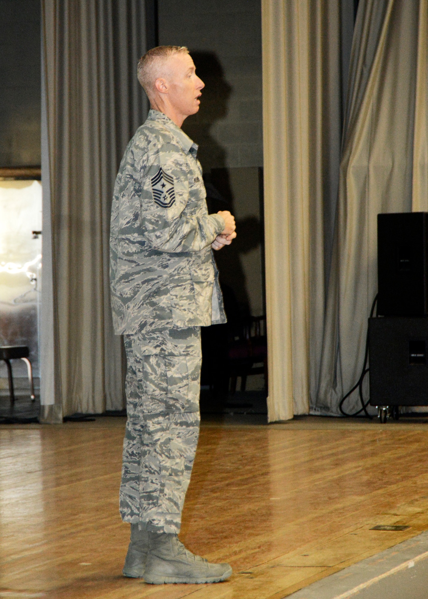 Chief Master Sgt. Michael Warner, Air Force Materiel Command command chief, addresses lower enlisted Airmen at the Base Theater Aug. 22 during a Chief's Call. Warner accompanied AFMC commander Gen. Janet Wolfenbarger during her three day visit to the high desert last week. (U.S. Air Force photo by Rebecca Amber)