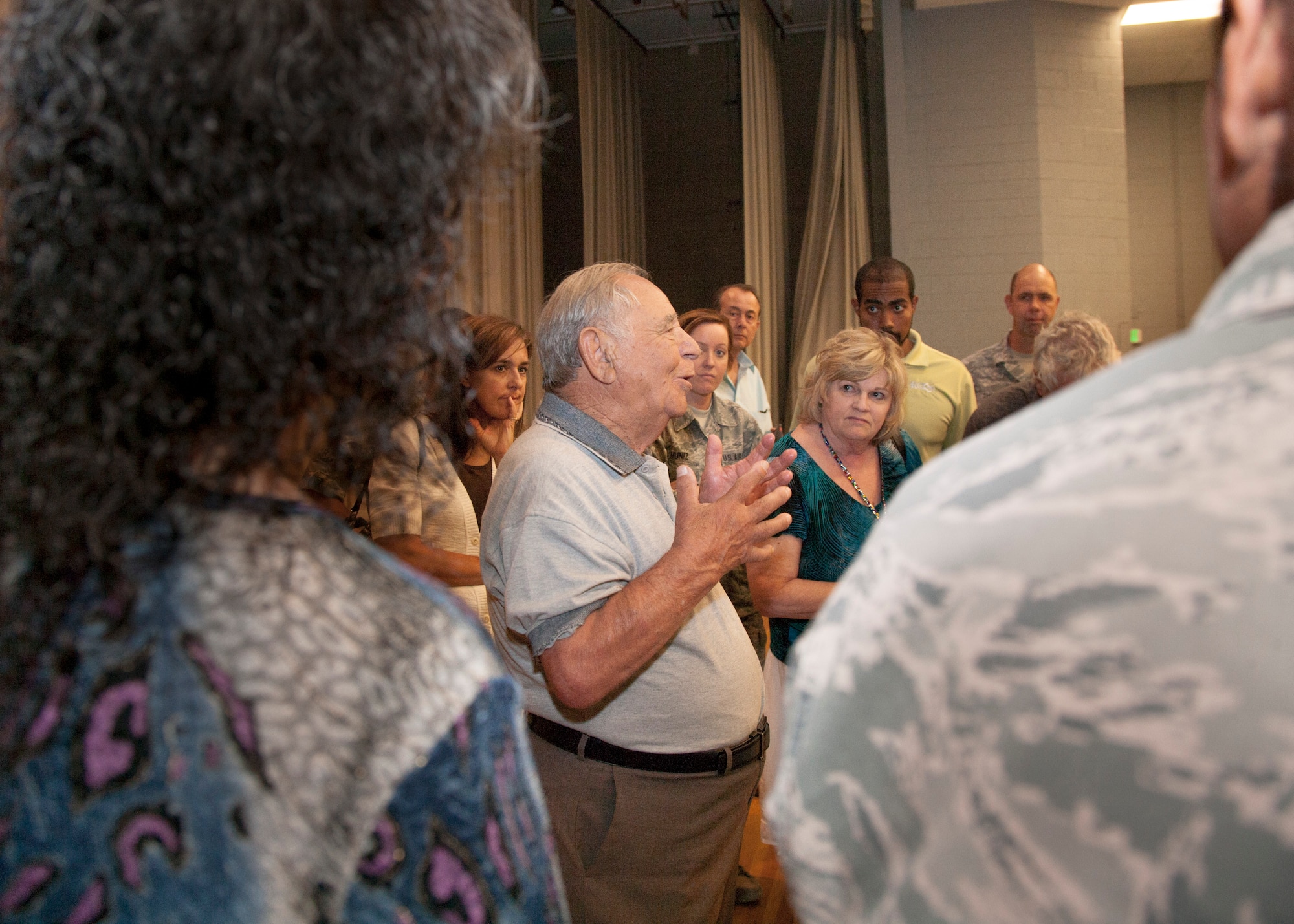 Albert Rosa talks to audience members at the Base Theater following a presentation given by the Holocaust survivor. Rosa and his brothers and sisters, along with many other Jewish men and women, were taken into captivity as slaves during the German invasion of Greece during World War II. (U.S. Air Force photo by Jennifer Correa) 