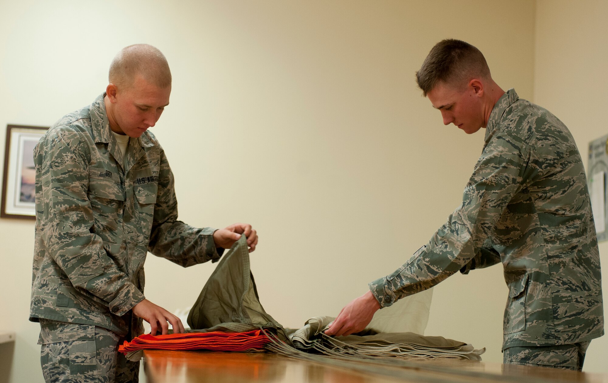 Airman Basic Zachary Cody of Lexington, N.C (left)., and Airman Basic Alex Barnes of Apple Valley, Minn., Both from the 361st Training Squadron, are aircrew flight equipment technicians who won the ACE award, The ACE award is given for scoring a 100 percent average throughout each block test. (U.S. Air force photo by Airman 1st Class Jelani Gibson) 
