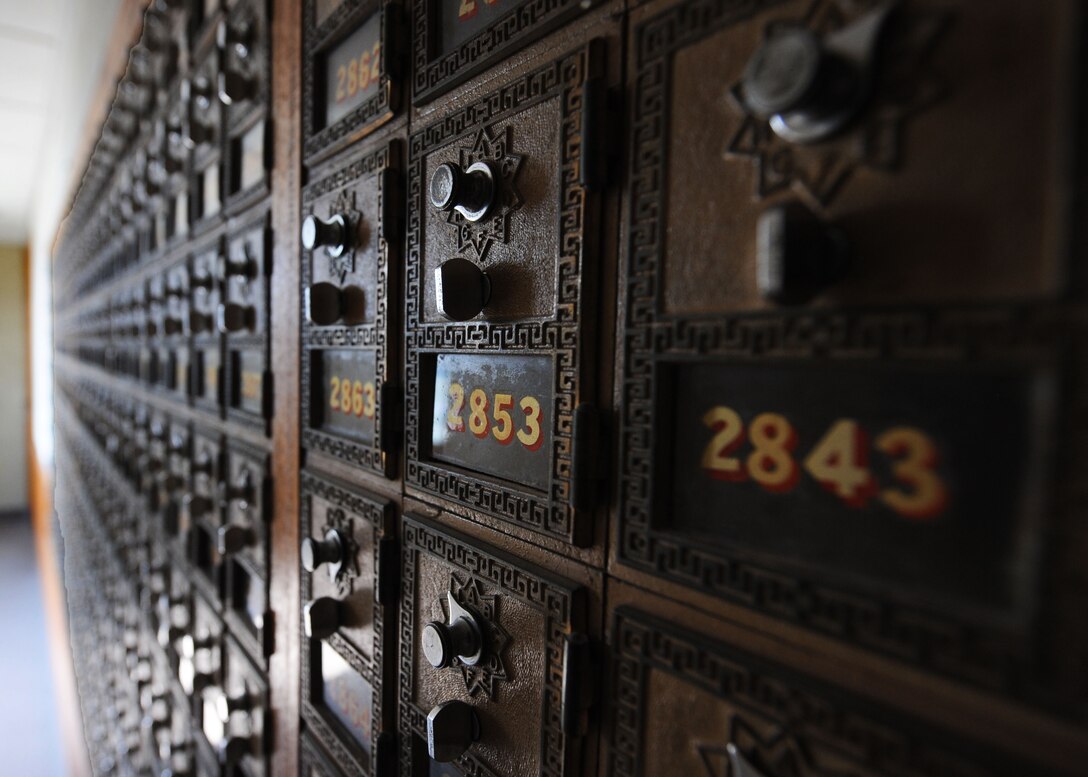 Post office boxes dating back to 1955 line the lobby of the Postal Service Center on Ellsworth Air Force Base, S.D., Aug. 15, 2013. There are over 1,700 boxes in the lobby that have been unused since 1999, when they were replaced by the mail boxes in the dormitory entry ways. (U.S. Air Force photo by Airman 1st Class Rebecca Imwalle/Released)