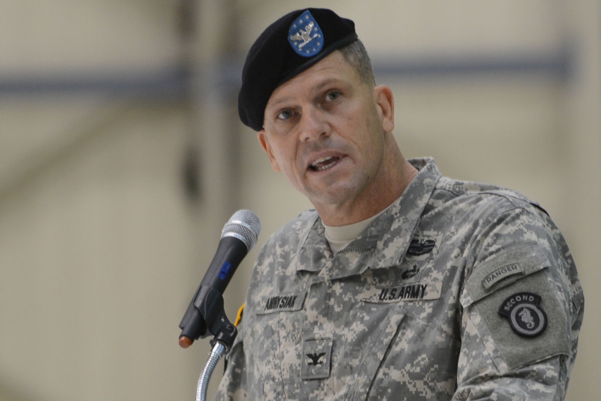 Army Col. Peter Andrysiak speaks during the ceremony in which he took command of the 2d Engineer Brigade at Hangar 1 on Joint Base Elmendorf-Richardson Thursday. Andrysiak takes over for Army Col. Thomas Roth in commanding the unit, the heritage of which dates back to the early 1940s and conflict in World War II and Korea. The brigade was reactivated in September of 2011 on JBER, and deploys Soldiers around the world. (U.S. Air Force photo/Airman Ty-Rico Lea)