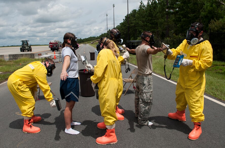 U. S. Air Force Airman 1st Class Bryana Hodge (left), and Senior Airman Justin Roberts (right), 23d Medical Group bioenvironmental engineering technicians, are being tested for radiation levels during a nuclear weapons incident exercise at Moody Air Force Base, Ga., Aug 16, 2013. This was one of the final steps taken before the Airmen could return to the clean zone, an area that tested negative for radiation. (U.S. Air Force photo by Airman 1st Class Sandra Marrero/released)
