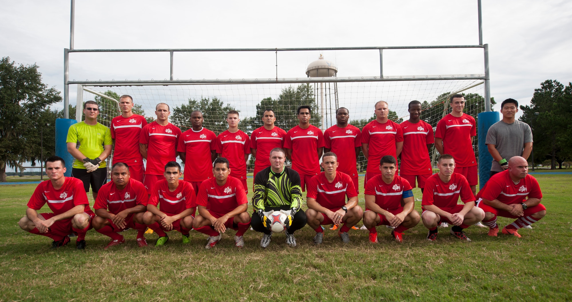 The Flying Tigers Football Club takes a group photo at Moody Air Force Base, Ga., Aug. 22, 2013. The FTFC is Moody AFB’s intramural soccer team and is open to Airmen and dependents of both sexes and all skill levels. (U.S. Air Force photo by Airman 1st Class Sandra Marrero/Released)
