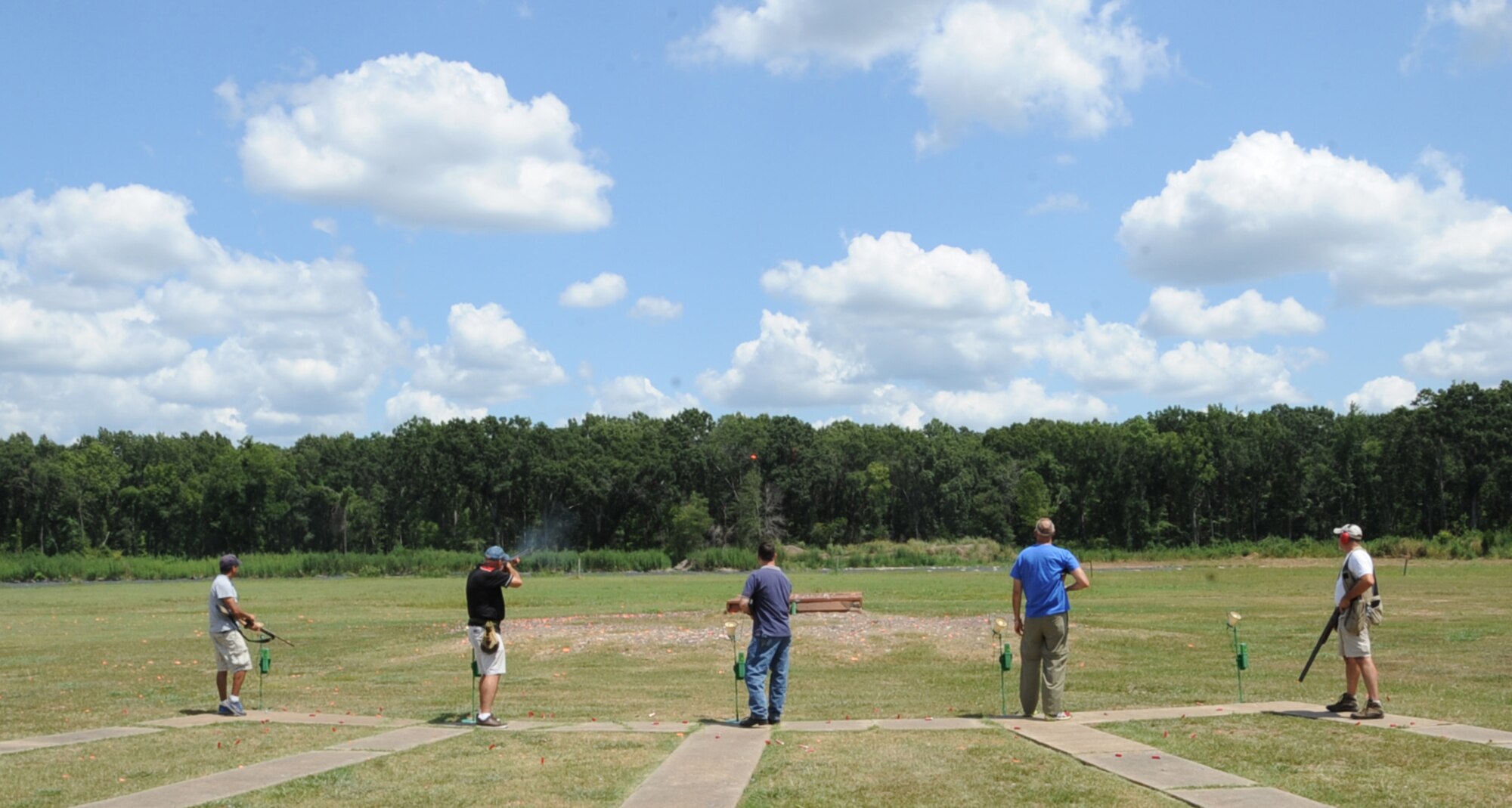 Base leadership shoot at clay targets on the five-stand sporting clay range at the Red Chute Gun Club on Barksdale Air Force Base, La., Aug. 24, 2013. At this type of range, shooters are given 25 rounds and alternate shooting at targets. They move one space to the right every five shots. (U.S. Air Force photo/Senior Airman Sean Martin)
