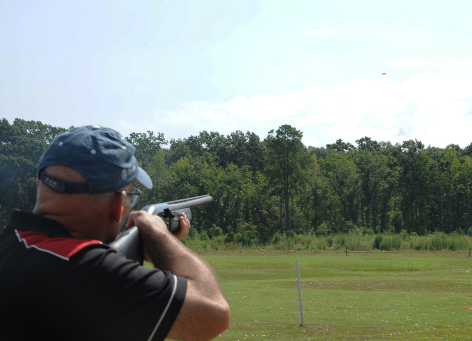 Col. Patrick Matthews, 2nd Mission Support Group commander, aims at a clay target at the Red Chute Shotgun Sports Club on Barksdale Air Force Base, La., Aug. 24, 2013. Base leadership came out to the club for a team building exercise to better lead their Airmen. (U.S. Air Force photo/Senior Airman Sean Martin)
