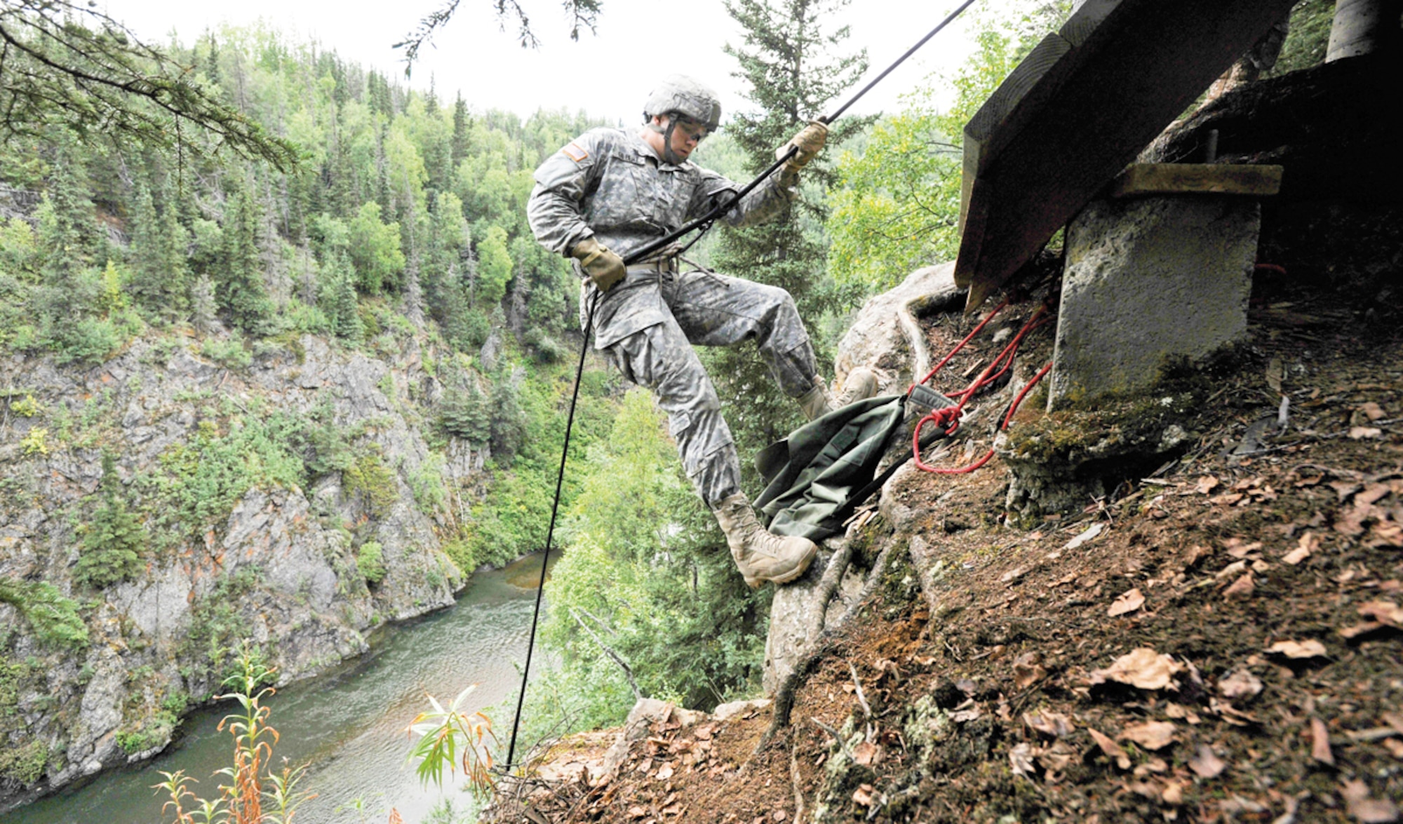 JOINT BASE ELMENDORF-RICHARDSON, Alaska -- Army Sgt. Nick Gilbert, assigned to the 6th Engineer Battalion (Combat) (Airborne), rappells down a cliff during the unit's Best Soldier Competition, Wednesday, Aug. 14, 2013. Competition events include a written test, a non-standard PT test, land navigation, weapons proficiency, a road march, drill and ceremony, common tasks testing, urban orienteering, rappelling, an obstacle course and appearing before a board of senior noncommissioned officers.  (U.S. Air Force photo/Justin Connaher)