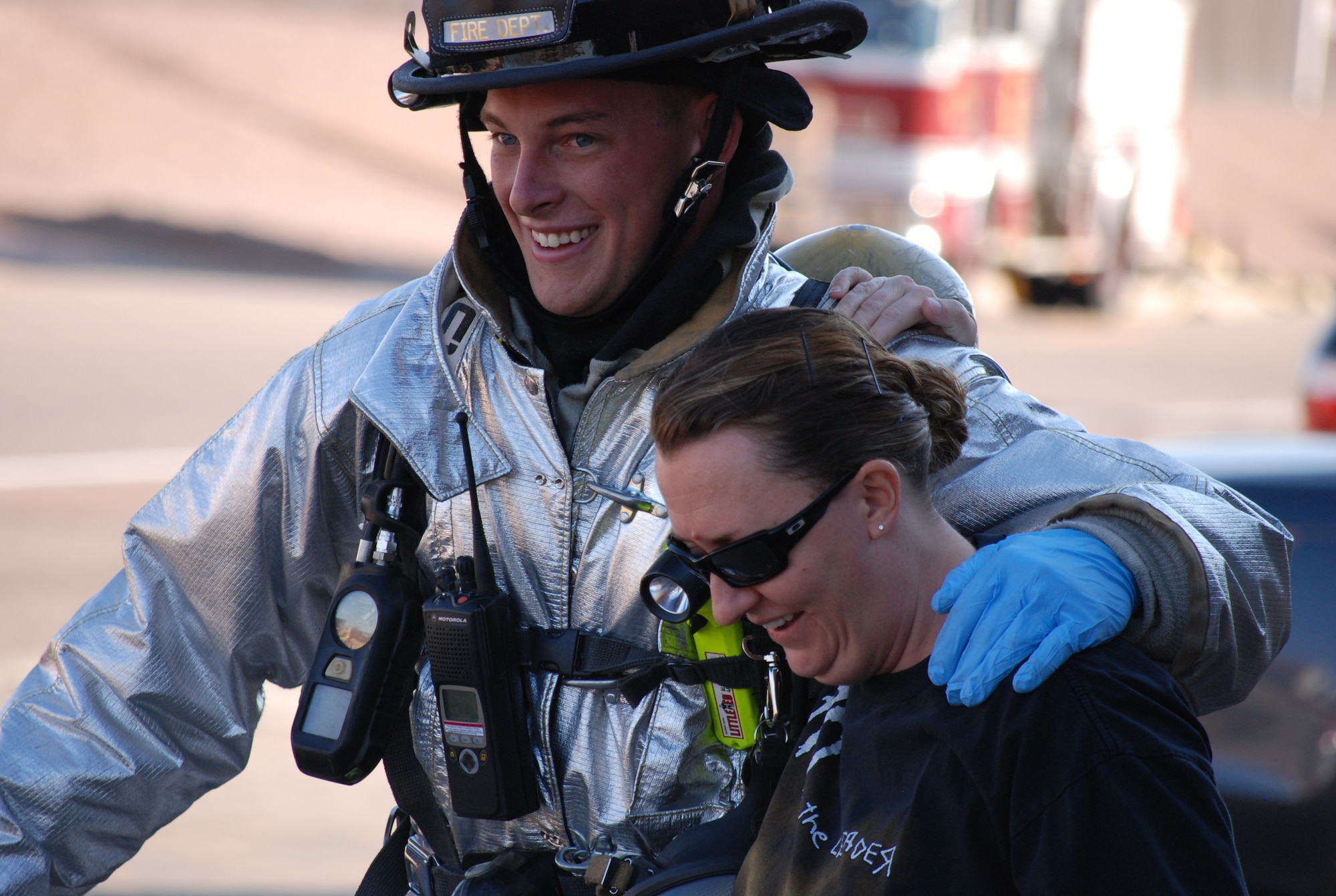 PETERSON AIR FORCE BASE, Colo. – A Peterson firefighter provides a casualty role-player with a shoulder to lean on as they walk towards the medical triage area. Condor Crest is designed to test and evaluate emergency response assets and provide full-scale training for first responders and base personnel. (U.S. Air Force photo/Michael Golembesky)