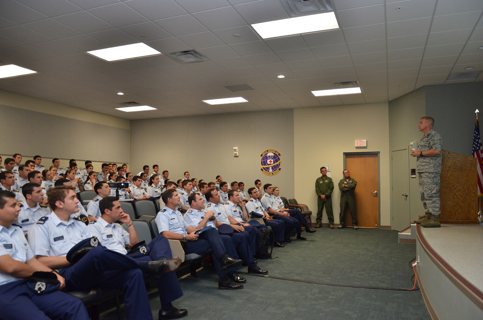 Col. Robert Ament, vice wing commander of the 920th Rescue Wing, gives a mission brief to more than 100 Chilean Air Force Academy cadets at Patrick Air Force Base, Fla., Aug. 26. The cadets were visiting PAFB to learn more about the rescue mission, and were given a brief and tour of an HH-60G Pave Hawk helicopter. (U.S. Air Force photo/ Staff Sgt. Katie Spencer)
