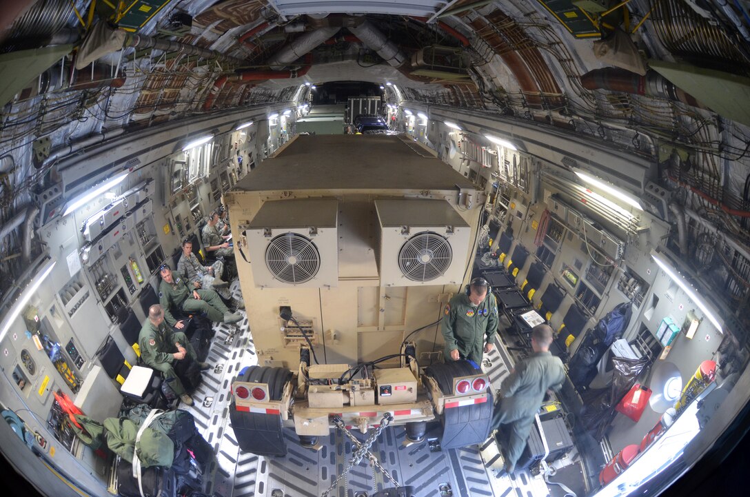 Westover's 439th Airlift Control Flight and two 42nd Aerial Port Squadron Airmen prepare to leave for Pueblo, Colorado on a C-17, Aug. 22, 2013 for the annual AFRC-sponsored air mobility exercise, "Patriot Express." The ALCF is responsible for the training of Air Force and sister service units on how to move by air. They instruct over 400 units in preparing and loading their mobility equipment for air shipment. (U.S. Air Force photo/SrA. Kelly Galloway)