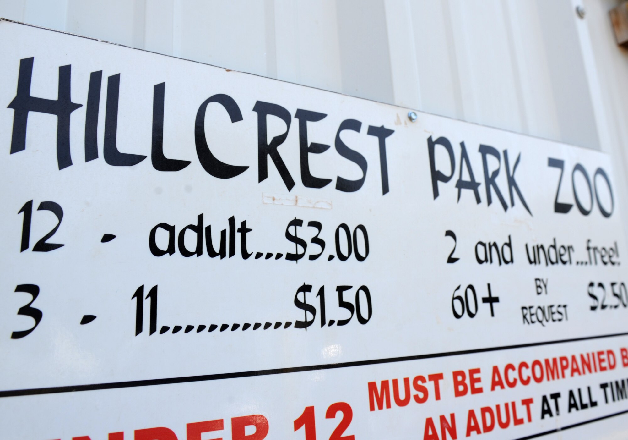 A sign advertises for the Hillcrest Park Zoo Aug. 17, 2013. Members of the 27th Special Operations Aircraft Maintenance Squadron Booster Club have spent many Saturday’s beautifying and improving the zoo. (U.S. Air Force photo/Senior Airman Ericka Engblom)

