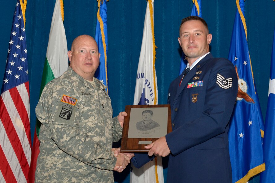 MCGHEE TYSON AIR NATIONAL GUARD BASE, Tenn. - Maj. Gen. Terry M. ?Max? Haston, Adjutant General for the state of Tennessee, presents Tech. Sgt. Vincent Girolami, right, attending the Noncommissioned Officers Academy Class 13-7, from the Nevada Air National Guard, the John L. Levitow Award at the I.G. Brown Training and Education Center here, Aug. 15, 2013. The Levitow is the highest award bestowed for Air Force enlisted professional military education. (U.S. Air National Guard photo by Master Sgt. Kurt Skoglund)