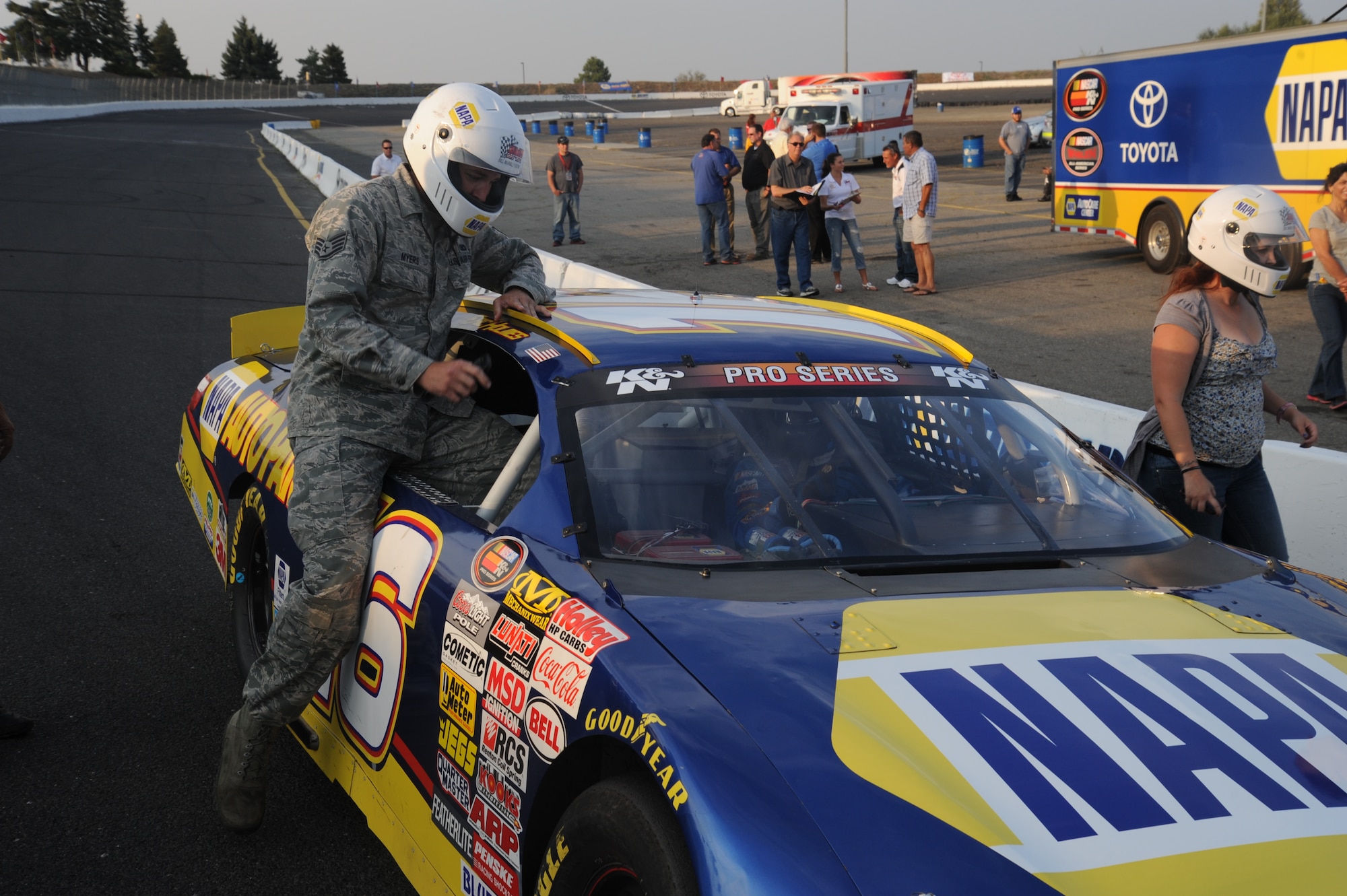 Staff Sgt. Brett Myers, 92nd Security Forces Squadron military working dog
handler, gets in a NAPA team race car at the Spokane County Raceway in Airway Heights, Wash., Aug. 23, 2013.  Throughout the week, several personnel from Fairchild got the opportunity to ride in the stock cars for three laps around the track.  (U.S. Air Force photo by Airman 1st Class Sam Fogleman/Released)
