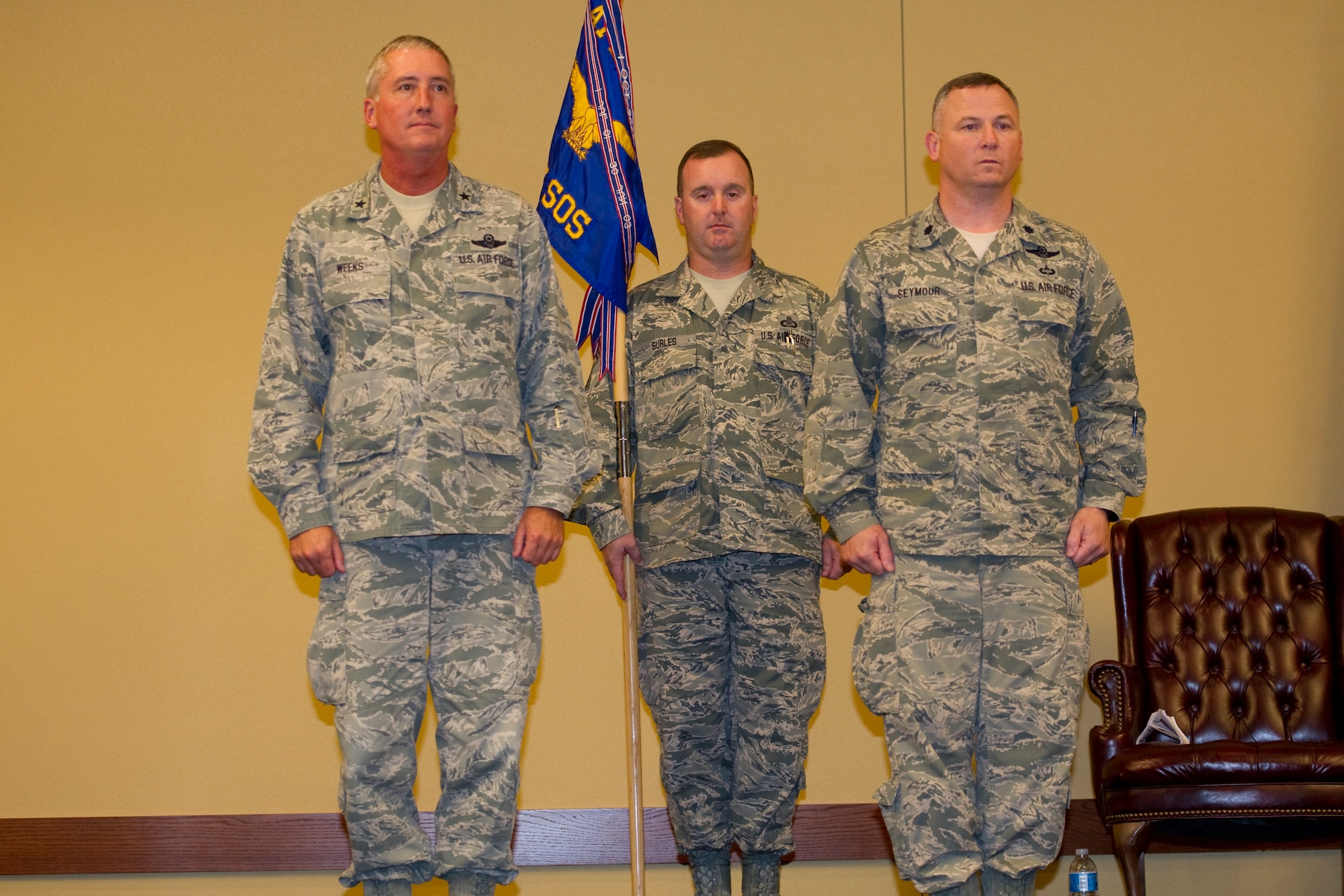 745th Special Operations Squadron Chief Maser Sgt. Mike Surles bears the unit's colors during a deactivation ceremony at Hurlburt Field, officiated by Air Force Special Operations Air Warfare Center Commander Brig. Gen. Jon Weeks and 745th SOS commander Lt. Col. Rick Seymour. (U.S. Air Force Photo/Senior Airman Naomi M. Griego)
