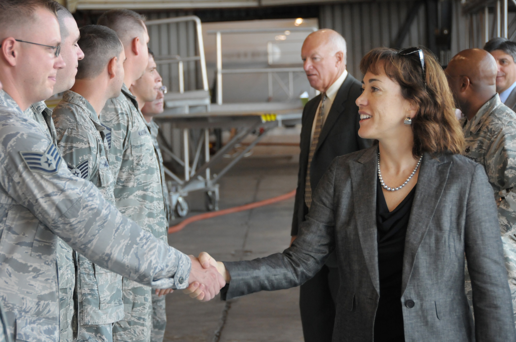 Dr. Janine Davidson, a member of the National Commission on the Structure of the Air Force, shakes hands with Tinker Air Force Base Airmen from the 552nd Air Control Wing during a visit on August 20. The commission visited parts of Tinker and held a public hearing during their trip to Oklahoma. (U.S. Air Force photo/Staff Sgt. Caleb Wanzer)