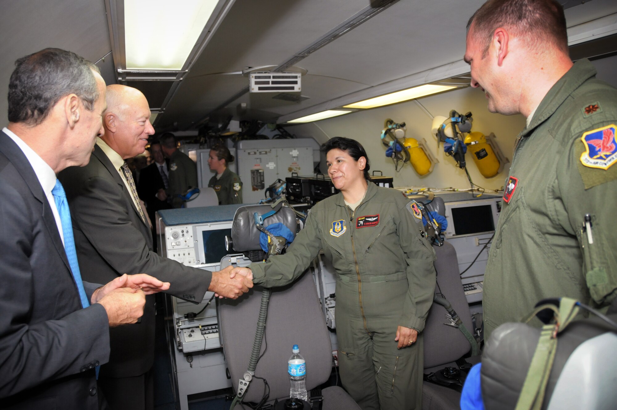 970th Airborne Air Control Squadron reservist Maj. Gracie Alvarez greets retired Lt. Gen. Harry “Bud” Wyatt III, a member of the National Commission on the Structure of the Air Force, during a tour of a E-3 Sentry on August 20. Members of the commission visited Tinker Air Force Base, Okla., and held a public hearing as a part of their research before reporting to Congress and the President early next year. (U. S. Air Force photo/Staff Sgt. Caleb Wanzer)