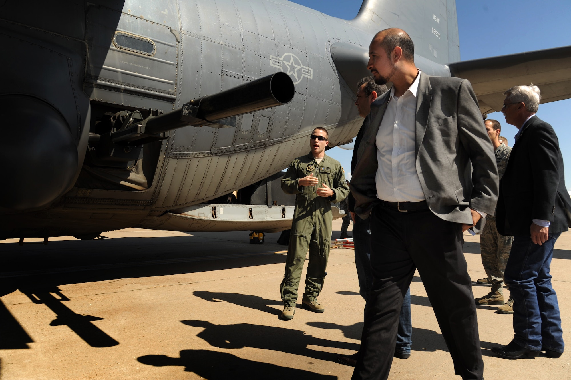Staff members of U.S. Congressman Ben Lujan, from New Mexico, view the AC-130H Spectre Gunship during a visit Aug. 23, 2013, at Cannon Air Force Base, N.M. Lujan’s tour of Cannon helped him gain a better understanding of base operations and the 27th Special Operations Wing’s mission.  (U.S. Air Force photo/Senior Airman Jette Carr)