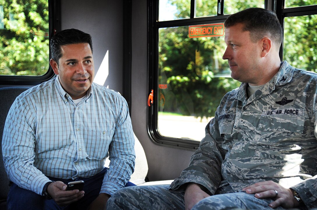 U.S. Congressman Ben Lujan, from New Mexico, talks with Col. Tony Bauernfeind, 27th Special Operations Wing commander, during a visit Aug. 23, 2013, at Cannon Air Force Base, N.M.  Lujan’s tour of Cannon helped him gain a better understanding of base operations and the 27 SOW mission.  (U.S. Air Force photo/Senior Airman Jette Carr)