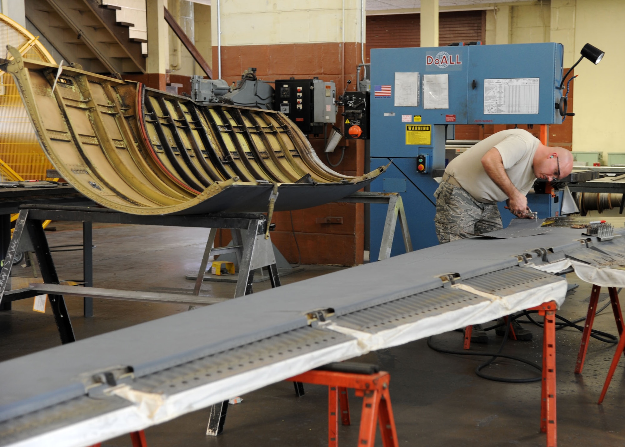 Tech. Sgt. Adam Joyce, 2nd Maintenance Squadron aircraft structural maintenance craftsman, places clecos in the right elevator panel of a B-52H Stratofortress on Barksdale Air Force Base, La., Aug. 23, 2013. Clecos are temporary fasteners used to hold down sheet metal while holes are drilled and rivets are placed. (U.S. Air Force photo/Senior Airman Joseph A. Pagán Jr.)