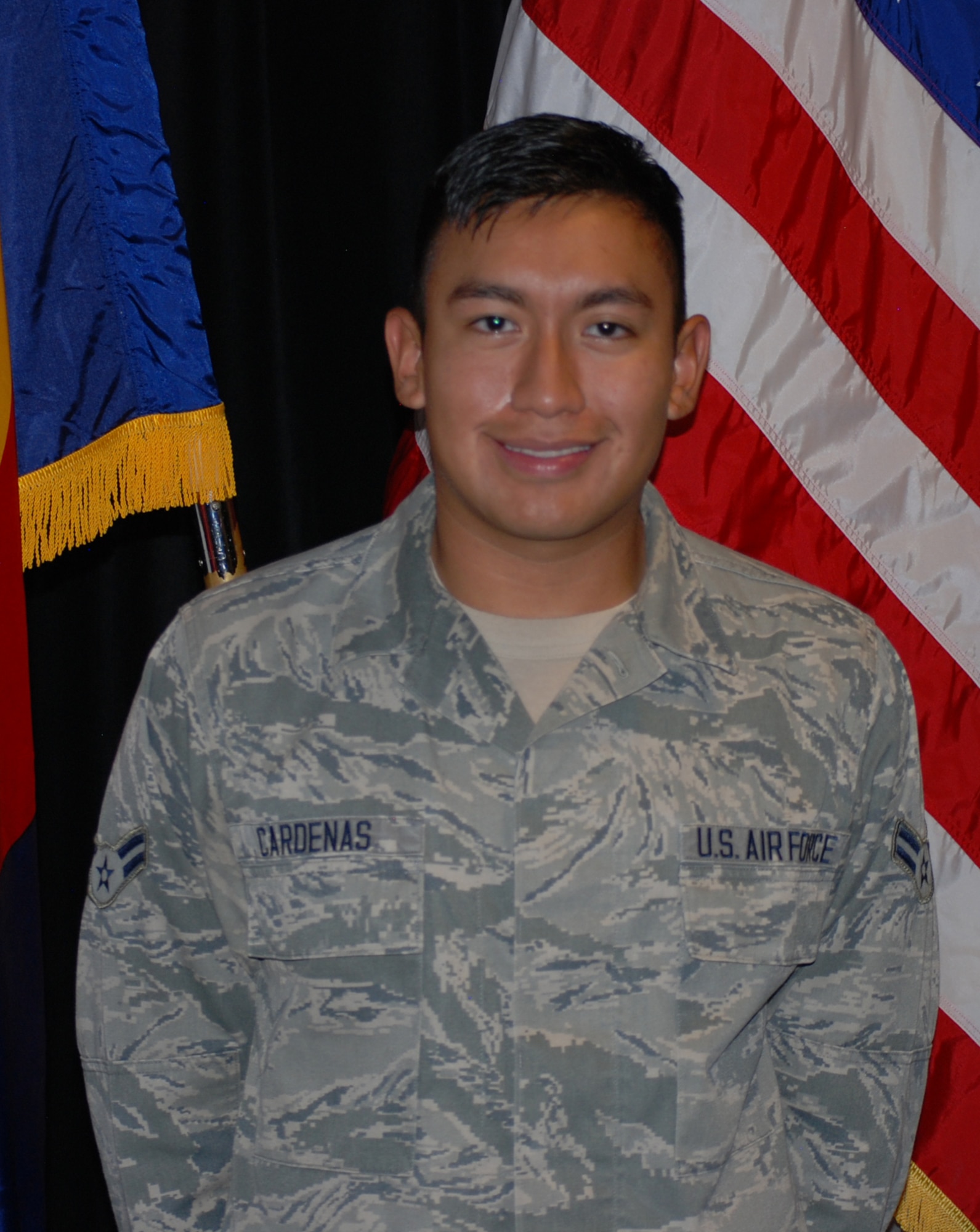 PETERSON AIR FORCE BASE, Colo. – Airman 1st Class Einer Cardenas, 21st Medical Operations Squadron aerospace medical technician, poses for a picture moments after becoming a U.S. citizen. (U.S. Air Force photo/Michael Golembesky)