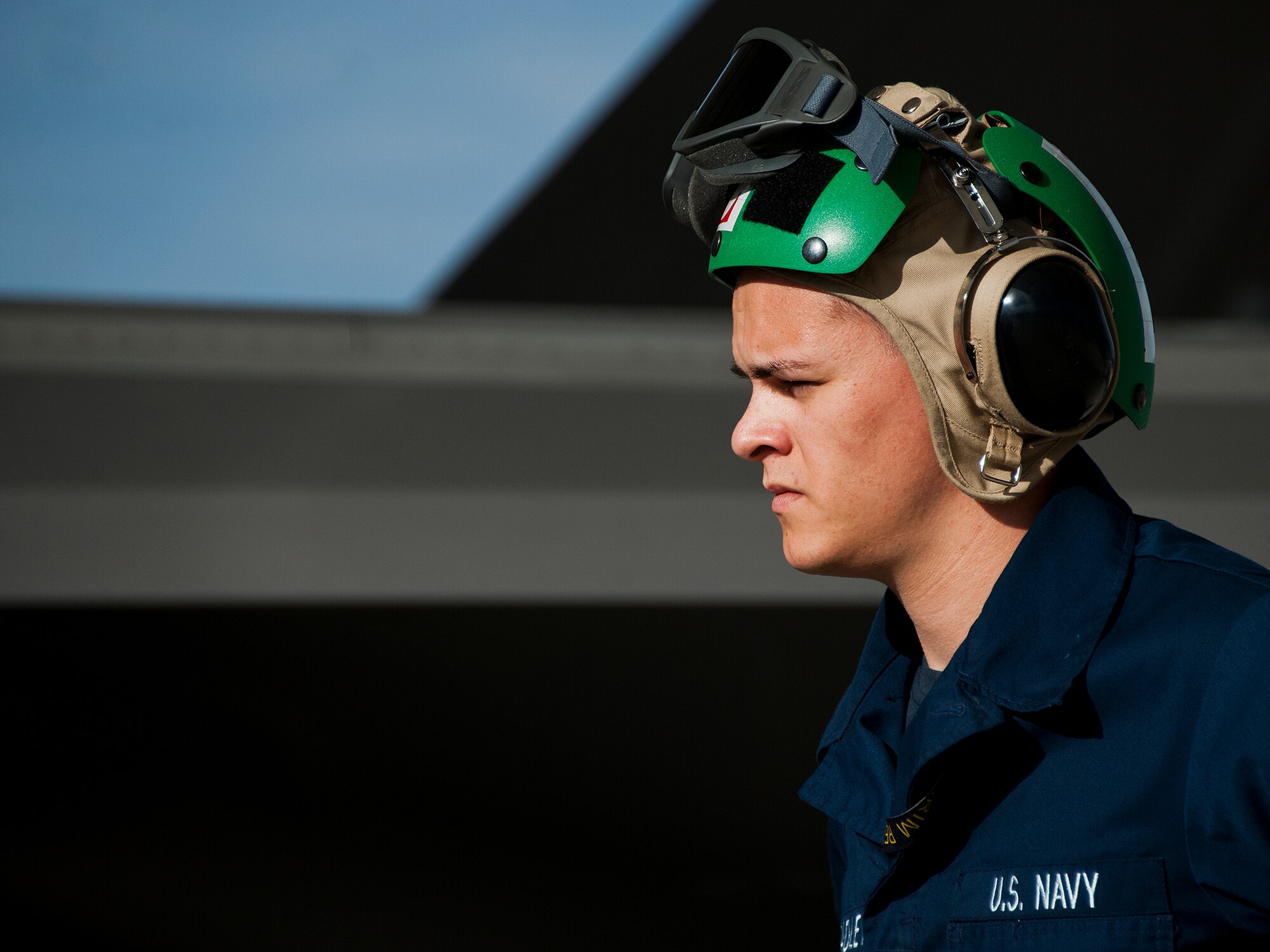 A Sailor with the Strike Fighter Squadron-101 watches the preflight procedures closely prior to an F-35C Lightning II sortie at Eglin Air Force Base, Fla.  Sailors, along with Airmen and Marines work directly with the LM maintainers to help put the joint strike fighters in the air.  (U.S. Air Force photo/Samuel King Jr.)