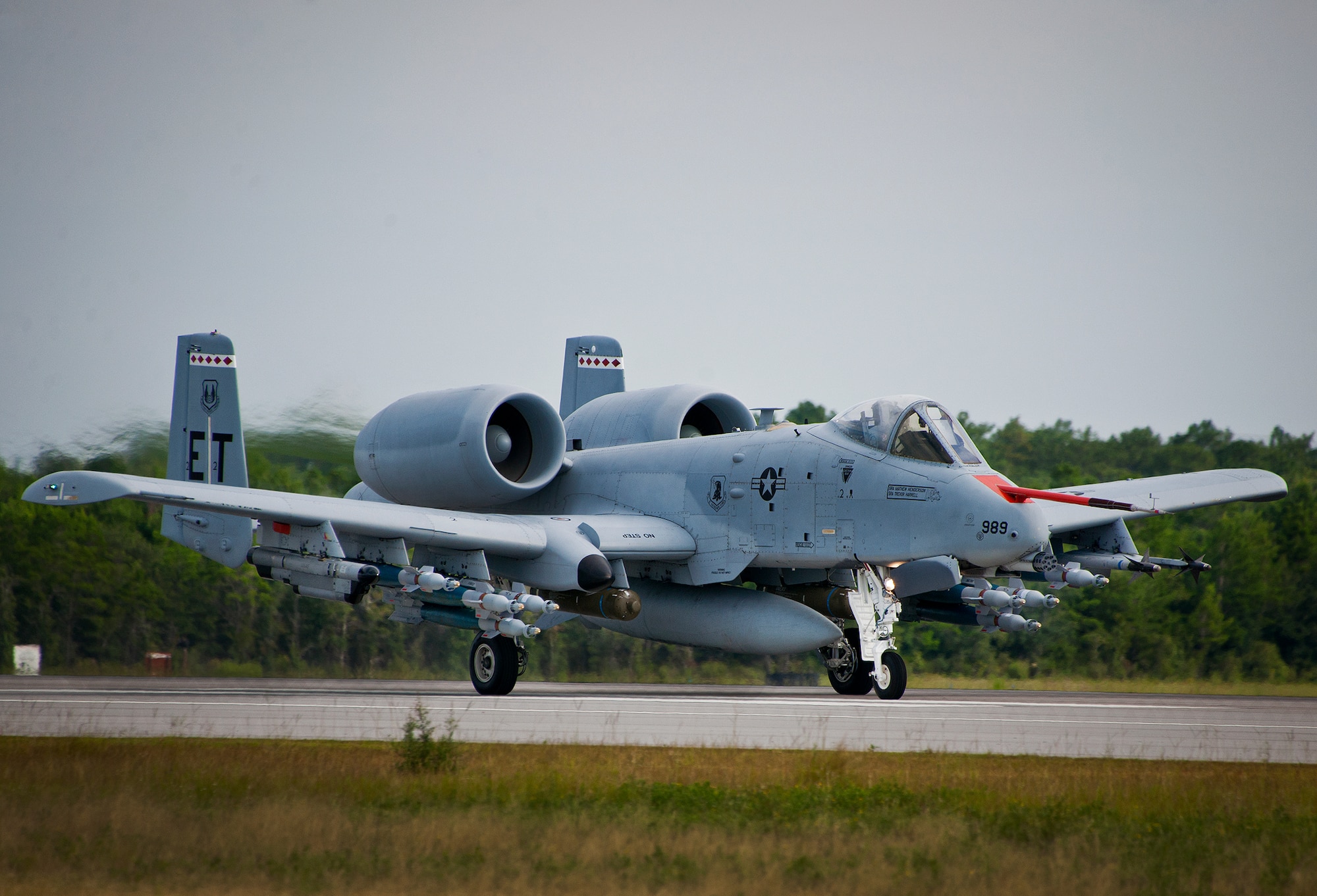 An A-10C Thunderbolt II from the 40th Flight Test Squadron, moves down the runway at Eglin Air Force Base, Fla.  The aircraft is loaded up with weaponry to test the combat carriage limits of the Sargent Fletcher external fuel tank.  The A-10 flight personnel are testing to ensure the A-10 can carry the tank into a combat environment safely.  If proven to be safe to carry, the tank will add up to 60 minutes of flighttime to its combat sortie.  (U.S. Air Force photo/Samuel King Jr.)