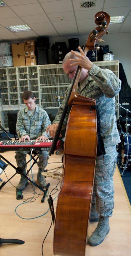 Left to Right: SrA Mike Mitchell and SrA Joe Whitt demonstrate jazz performance techniques during a masterclass for Ramstein and Kaiserslautern High School students.  This masterclass allowed the members of the Ambassadors Jazz Combo to share their musical knowledge and experience with young upcoming musicians.