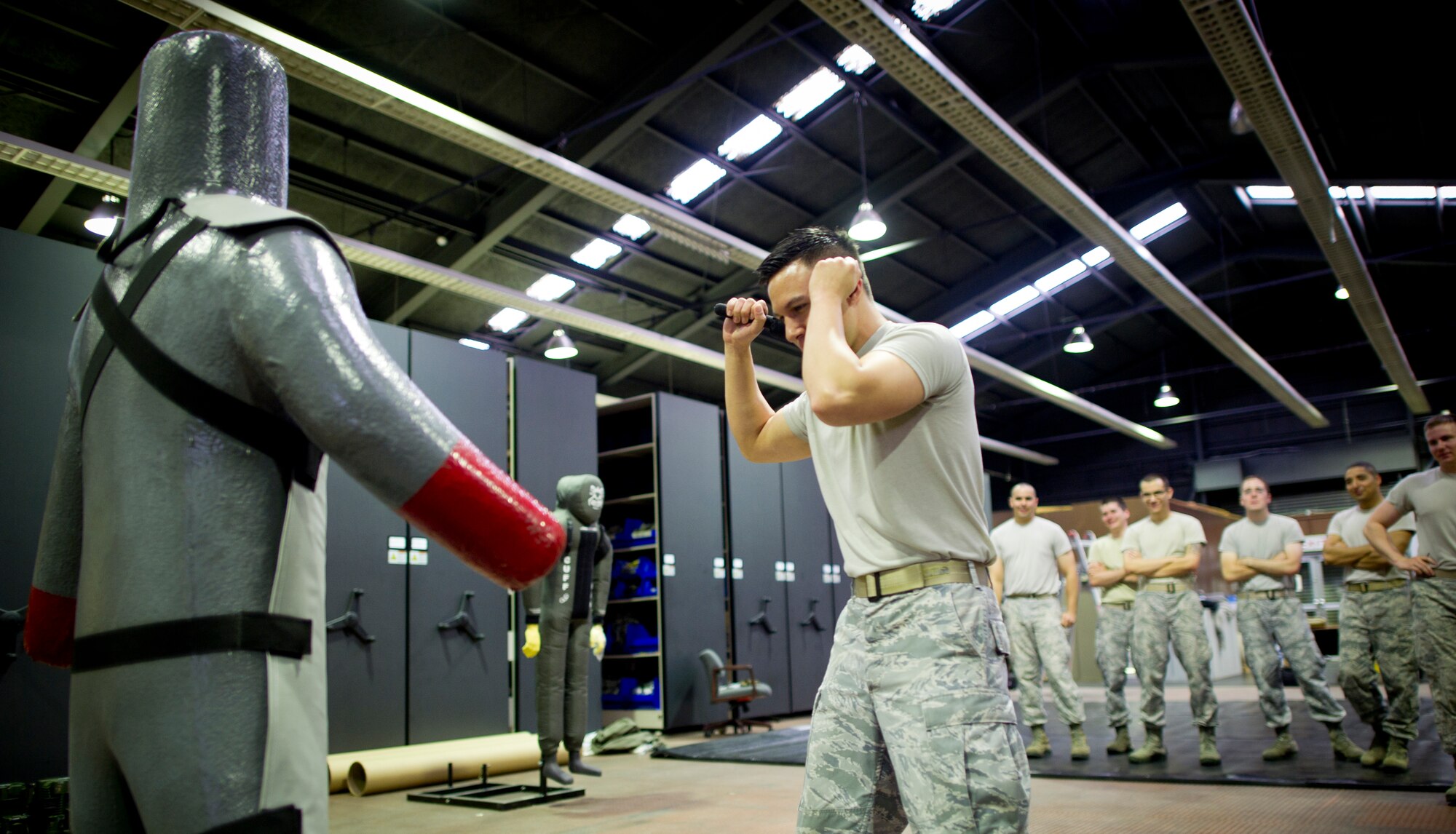 YOKOTA AIR BASE, Japan— Senior Airman Nichols Mullinnix, 374th Security Forces Squadron, prepares to strike a dummy as a part of combative training during Fly-away security training at Yokota Air Base, Japan Aug. 19-23, 2013. Students received hands-on practical training in subjects such as self-defense and anti-hijacking training.  Fly-away security team members, who are embedded in an aircrew, travel with any Yokota aircraft that travels into potentially dangerous areas of the Pacific Region to protect the aircraft and aircrew from potential threats. (U.S. Air Force photo by Senior Airman Desiree Economides)