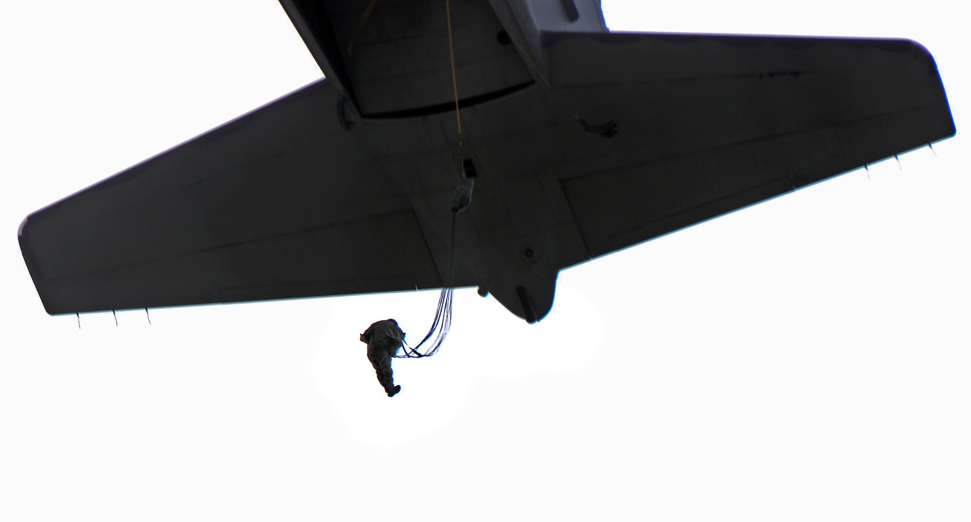 A member of the 736th Security Forces Squadron jump from a C-130 Hercules Aug. 21, 2013, during a static line jump training over Andersen Air Force Base, Guam. As the integrated force protection element of the 36th Contingency Response Group, members of the 736th SFS provide a quick-response airborne capability that serves as an advance echelon team for contingency and humanitarian missions all over the Asia-Pacific region. (U.S. Air Force photo by Airman 1st Class Marianique Santos/Released)