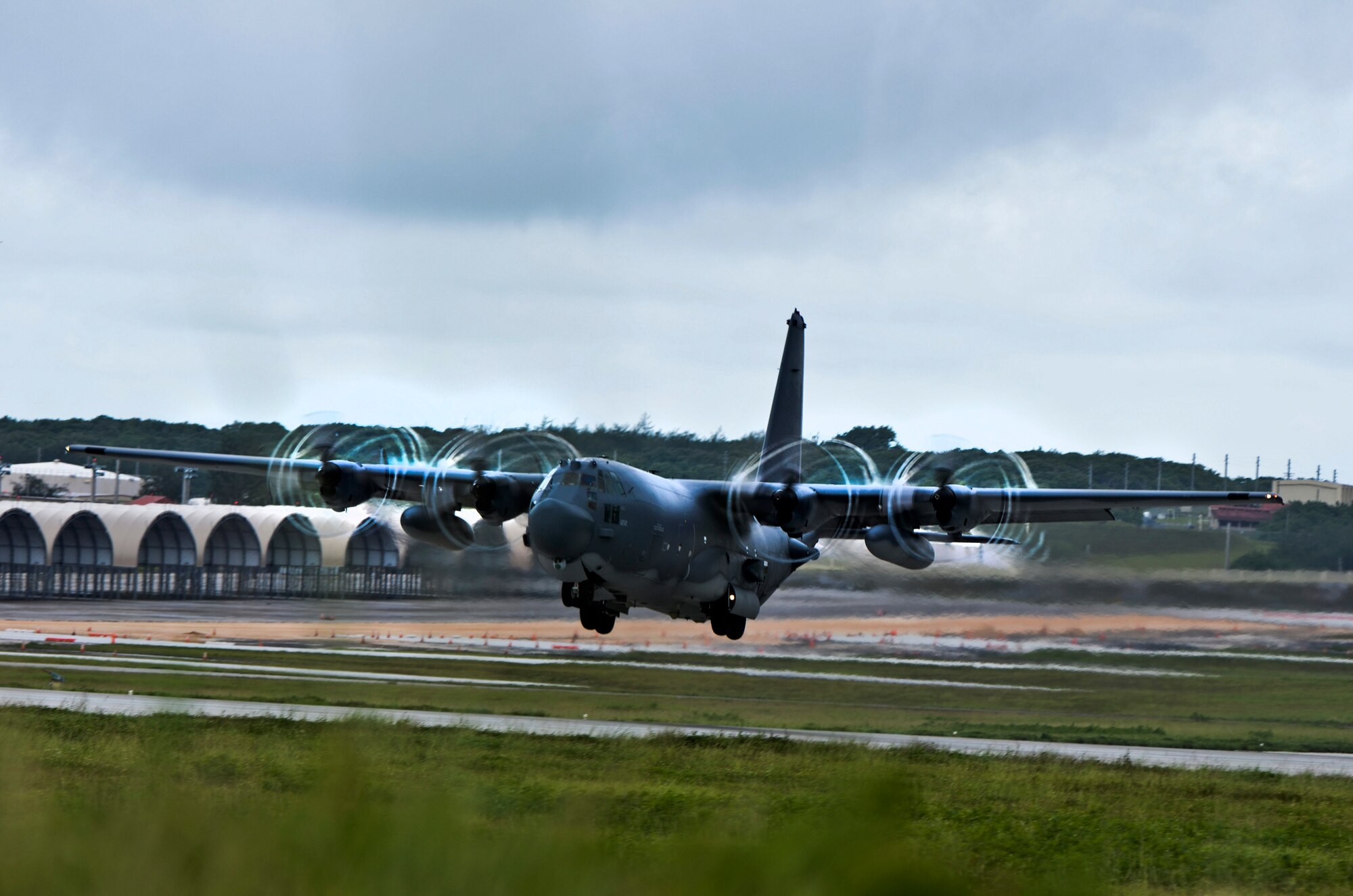 A C-130 Hercules takes off from Andersen Air Force Base, Guam for a static jump training mission, Aug. 21, 2013. The day of training, the jumpers receive standardized airborne training, starting with a briefing from the jumpmasters. (U.S. Air Force photo by Airman 1st Class Marianique Santos/Released)