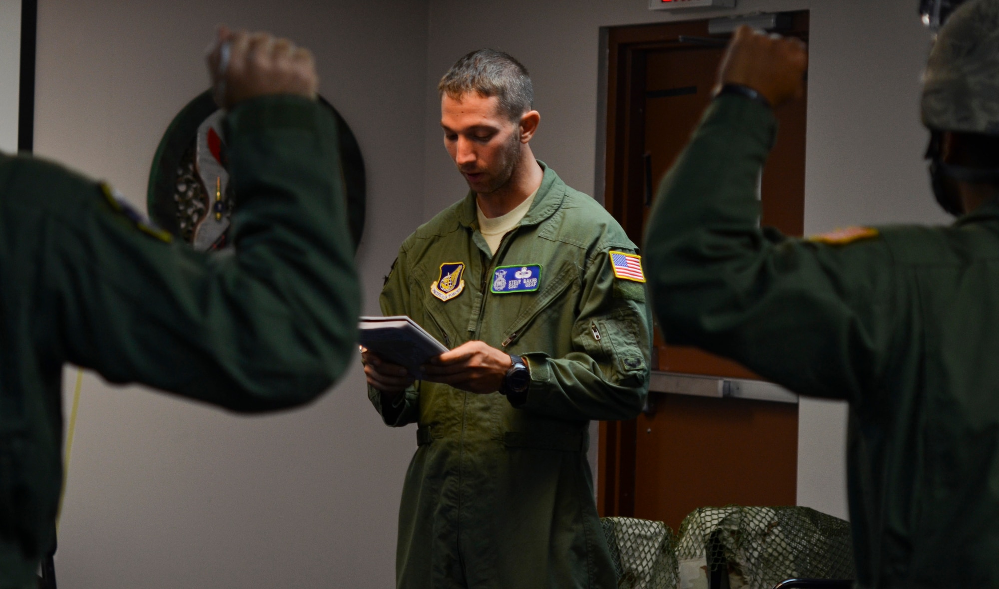 Staff Sgt. Stephen Baker, 736th Security Forces Squadron parachute program manager, briefs Airmen on procedures and safety precautions Aug. 21 before a static line jump on Andersen Air Force Base, Guam. The day of training, the jumpers receive standardized airborne training, starting with a briefing from the jumpmasters. (U.S. Air Force photo by Airman 1st Class Marianique Santos/Released)