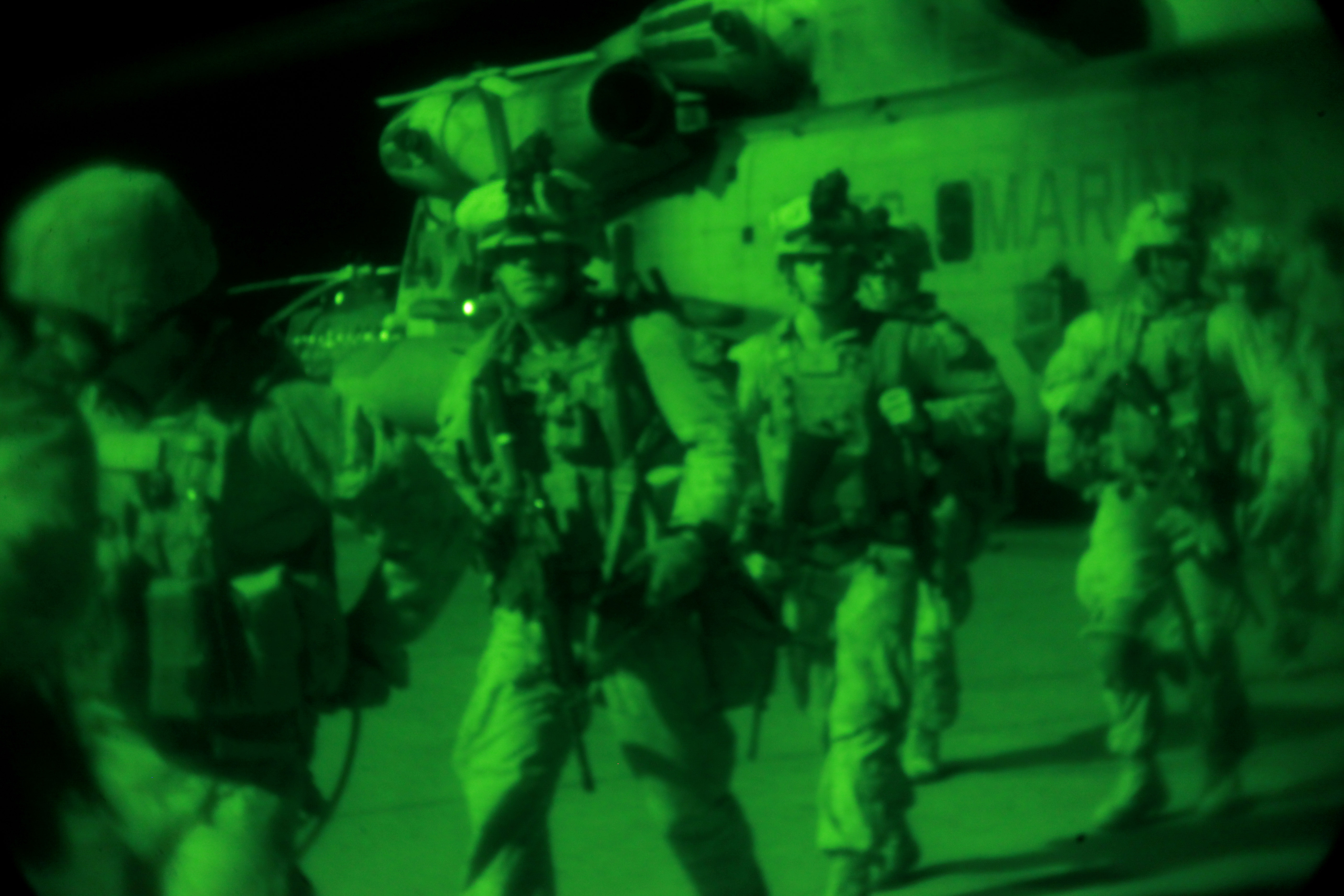 As Seen Through A Night Vision Device U S Marines And Afghan National Security Forces Exit A