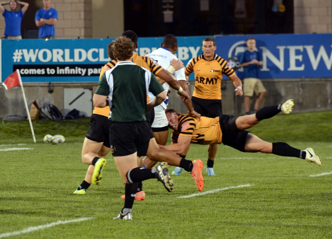 Maj. Nate Conkey of Joint Base Lewis-McChord, Wash., via Falls Church, Va., sets the defensive tone for All-Army during the Soldiers' 19-14 victory over All-Air Force in the gold-medal game of the 2013 Armed Forces Rugby Championships on Aug. 17 at Infinity Park in Glendale, Colo. U.S. Army photo by Tim Hipps, IMCOM Public Affairs