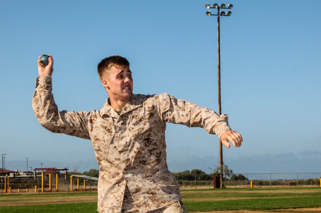 Lance Cpl. Austin Enders, intelligence specialist, Command Element, 15th Marine Expeditionary Unit, aims for the impact area hit during a unit Combat Fitness Test aboard Camp Pendleton, Calif., Aug. 21, 2013. Ender, 19, is from Halifax, Pa. (U.S. Marine Corps Photo by Cpl. Emmanuel Ramos/Released)