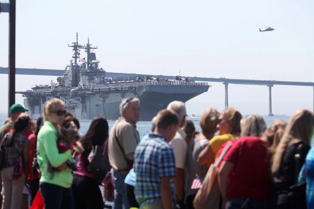 Family members and friends of Marines with the 13th Marine Expeditionary Unit wait to get a last look at their service member aboard the USS Boxer at San Diego, Aug. 23. More than 2,400 Marines and sailors with the 13th MEU departed for deployment with the Boxer Amphibious Ready Group.