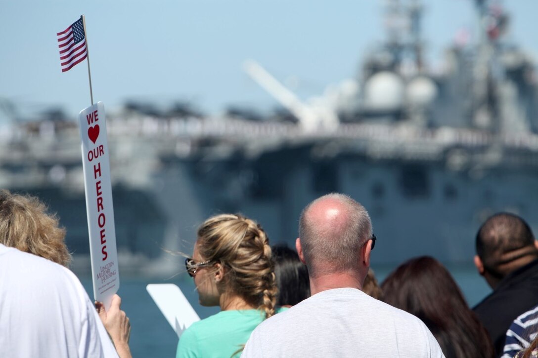 Friends and family members of Marines with the 13th Marine Expeditionary Unit watch their service members depart aboard the USS Boxer at San Diego, Aug. 23. More than 2,400 Marines and sailors with the 13th MEU departed for deployment with the Boxer Amphibious Ready Group.