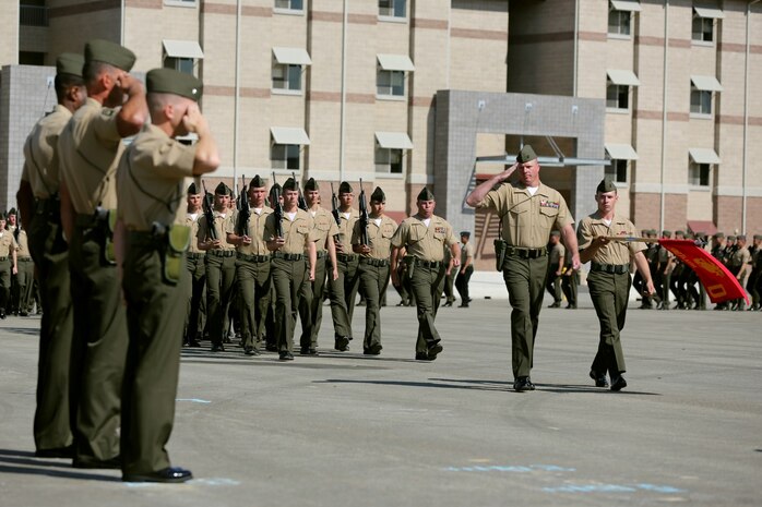 MARINE CORPS BASE CAMP PENDLETON, Calif. – Marines serving with 3rd Assault Amphibian Battalion salute during the pass and review portion of a relief and appointment ceremony where Sgt. Maj. Michael P. Woods took over as the battalion sergeant major here, Aug. 23, 2013. Relief and appointment ceremonies are one of the many traditions upheld in the Marine Corps today, which involves the passing of the noncommissioned officer sword from the outgoing sergeant major to the oncoming. The passing of the sword signifies the transfer of responsibility and entails the transfer of total accountability and authority, from one senior enlisted Marine to another. The sword thus continues as the personification of military tradition and is entrusted to those most responsible for maintaining it.