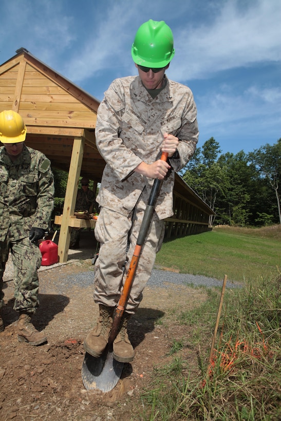 MOUNT HOPE, W. Va. -- Lance Cpl. Christopher D. Stewart-Mattison, engineer equipment operator with 6th Engineer Support Battalion, attempts to break through a hardened layer of clay blocking a designated drill site during a project in support of Innovative Readiness Training Joint Task Force Summit West Virginia, Aug. 6, 2013.  IRT Summit is an engineering IRT event during which Marines, sailors and soldiers developed an egress road and various vertical buildings in support of the town of Mt. Hope, W. Va. (U.S. Marine Corps photo by Cpl. Fenton Reese)