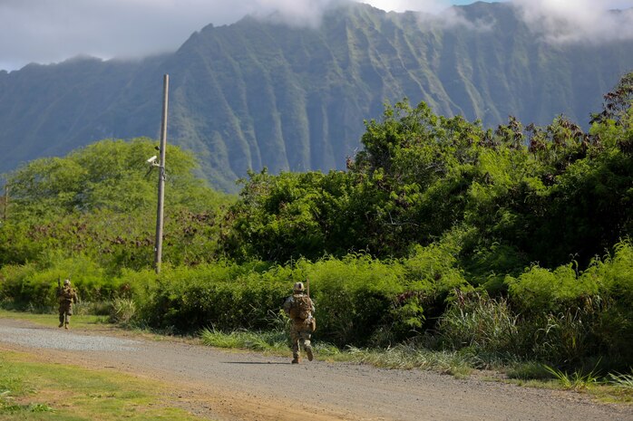 Marines serving with Alpha Company, 1st Reconnaissance Battalion, patrol to a nearby military operations on urban terrain training facility here, Aug. 20, 2013. The Marines participated in a mission rehearsal exercise as they prepared to deploy with the 11th Marine Expeditionary Unit.