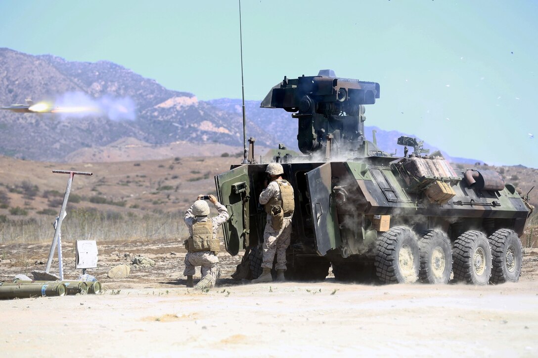 Marines serving with Alpha Company, 1st Light Armored Reconnaissance Battalion, fire the anti-tank guided missile during a training exercise here, Aug. 20, 2013. The purpose of the exercise was to cross train the riflemen serving with 1st LAR on the weapons systems of the light armored vehicle. The riflemen must know how to operate and maintain the light armored vehicles' weapons systems in preparation for future combat operations.