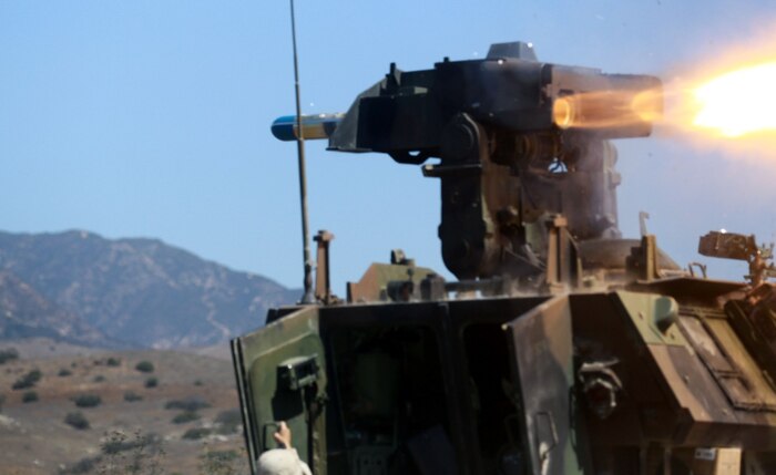Marines serving with Alpha Company, 1st Light Armored Reconnaissance Battalion, fire an anti-tank guided missile during a training exercise here, Aug. 20, 2013. The purpose of the exercise was to cross train the riflemen serving with 1st LAR on the weapons systems of the light armored vehicle. The riflemen must know how to operate and maintain the light armored vehicles' weapons systems in preparation for future combat operations.