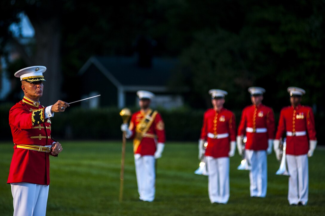 Maj. Brian Dix, director of the U.S. Marine Drum & Bugle Corps, performs during a parade held at Marine Barracks Washington, D.C., for the Brigadier General Select Orientation Course, Aug. 26. (Official Marine Corps photo by Lance Cpl. Dan Hosack/Released)