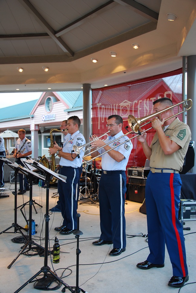 MILILANI, Hawaii -- Gunnery Sergeant Mark Lemstrom, Marine Corps Forces Pacific Fleet Band, joins forces with the Air Force Band of the Pacific-Hawaii,on the trombone,at the Mililani Concert Series in Mililani,Hawaii, Aug. 9, 2013. The Band of the Pacific-Hawaii participated in three summer concerts in Mililani. The concert series helped build stronger community relations with the town, and the hundreds of people who attended the concerts.

(US Air Force Photo/Ms. Nicolle Euredjian / released)
