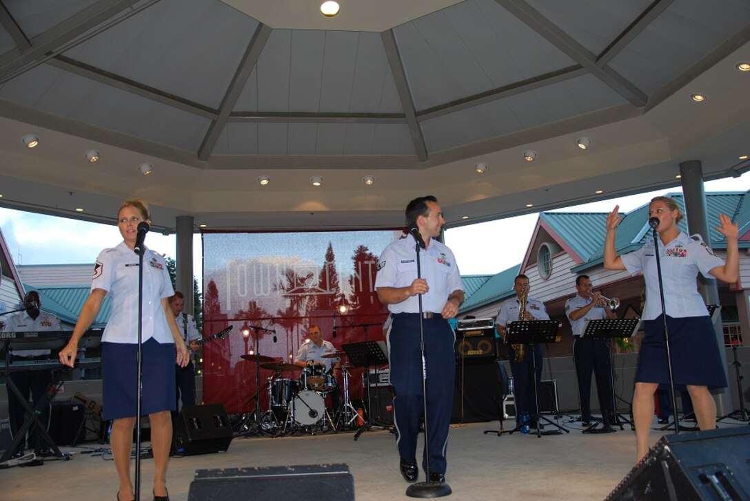 MILILANI, Hawaii -- (from left): MSgt Lara Murdzia, SrA Devin Rivas-Martin, and SSgt Courtney Clifford, Band of the Pacific-Hawaii, sing perfect harmonies at the Mililani Concert Series in Mililani,Hawaii, Aug. 9, 2013. The Band of the Pacific-Hawaii participated in three summer concerts in Mililani. The concert series helped build stronger community relations with the town, and the hundreds of people who attended the concerts.

(US Air Force Photo/Ms. Nicolle Euredjian/ released)