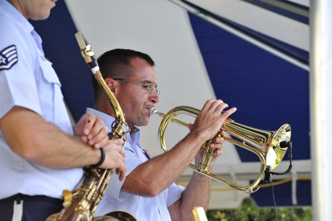 JOINT BASE PEARL HARBOR-HICKAM, Hawaii -- Technical Sergeant David Diamond, Band of the Pacific-Hawaii, plays a horn line during the concert on Joint Base Pearl Harbor-Hickam, Hawaii, Aug. 23, 2013. The United States Air Force Band of the Pacific-Hawaii and the Navy Fleet Band performed two joint concerts over the summer to an audience of about 1,500 people. The joint concerts build strong relations between the Navy and Air force, while narrowing the gap between the Hickam and Pearl Harbor sides of the base. 

(US Air Force Photo/ SSgt Courtney Clifford/ released)