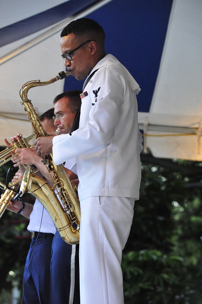 JOINT BASE PEARL HARBOR-HICKAM, Hawaii -- Musician 3rd Class Jason Gay, Navy Fleet Band, performs an amazing saxophone solo on Joint Base Pearl Harbor-Hickam, Hawaii, Aug. 23, 2013. The United States Air Force Band of the Pacific-Hawaii and the Navy Fleet Band performed two joint concerts over the summer to an audience of about 1,500 people. The joint concerts build strong relations between the Navy and Air force, while narrowing the gap between the Hickam and Pearl Harbor sides of the base. 

(US Air Force Photo/ SSgt Courtney Clifford/ released)