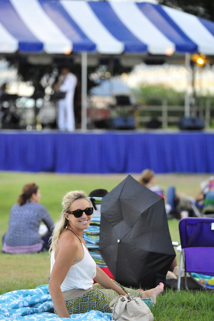 JOINT BASE PEARL HARBOR-HICKAM, Hawaii -- Jill Trahon, an audience member at the concert on Joint Base Pearl Harbor-Hickam, Hawaii, Aug. 23, 2013, enjoys the smooth sounds of Jazz during a beautiful summer afternoon. The United States Air Force Band of the Pacific-Hawaii and the Navy Fleet Band performed two joint concerts over the summer to an audience of about 1,500 people. The joint concerts build strong relations between the Navy and Air force, while narrowing the gap between the Hickam and Pearl Harbor sides of the base. 

(US Air Force Photo/ SSgt Courtney Clifford/ released)