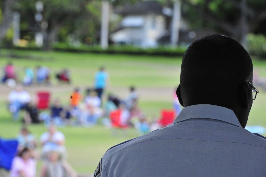 JOINT BASE PEARL HARBOR-HICKAM, Hawaii -- Master Sergeant Darryl McEachin, Band of the Pacific-Hawaii, performs on the keyboard for a sea of people during a joint band concert at Joint Base Pearl Harbor-Hickam, Hawaii, Aug. 23, 2013. The United States Air Force Band of the Pacific-Hawaii and the Navy Fleet Band performed two joint concerts over the summer to an audience of about 1,500 people. The joint concerts build strong relations between the Navy and Air force, while narrowing the gap between the Hickam and Pearl Harbor sides of the base. 

(US Air Force Photo/ SSgt Courtney Clifford/ released)